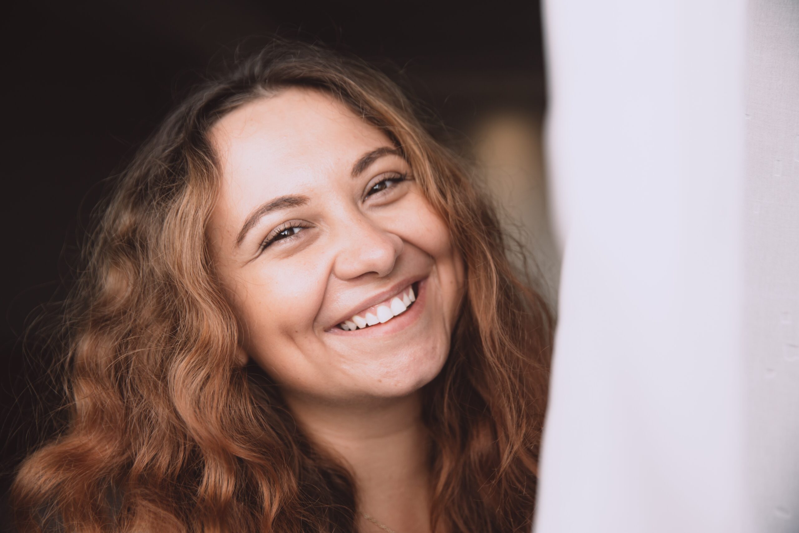 portrait-of-happy-smiling-redhead-curly-young-wom-2025-02-22-04-38-57-utc